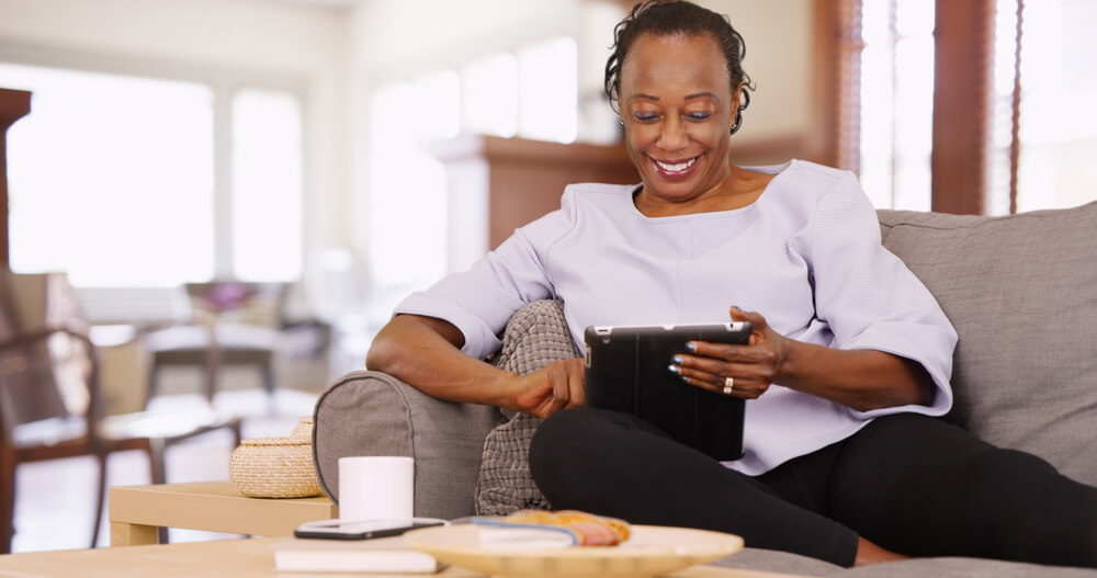 woman looking at her tablet