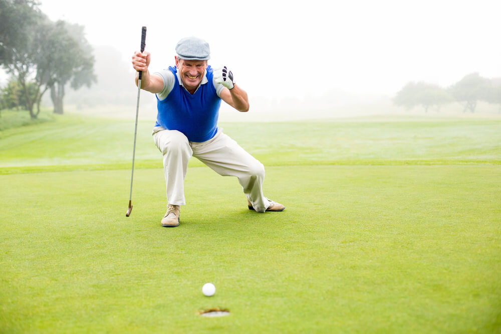 Senior man playing golf